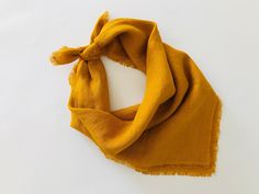 a yellow scarf on a white background