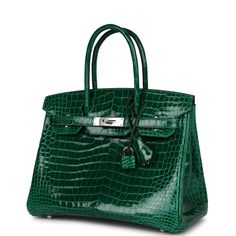 This Birkin is in Emerald shiny Niloticus crocodile with palladium hardware and has tonal stitching, front flap, two straps with center toggle closure, clochette with lock and two keys, and double rolled handles.The interior is lined with Emerald chevre and has one zip pocket with an Hermes engraved zipper pull and an open pocket on the opposite side.Collection: Q Square Origin: FranceCondition: Excellent - This bag retains its shape and structure, the exterior shows minor signs of wear, the ext Emerald Green Hermes Bag, Hermes Crocodile Bag, Birkin 30, Hermes Birkin 30, Hermes Box, Sierra Leone, Hermes Birkin, High Quality Leather, Givenchy