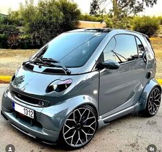 the smart car is parked on the street