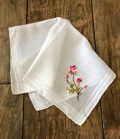 "This handkerchief features pretty colors with raised floral detail. It is in very good vintage condition. Use it as a personal accessory, at your celebration, for crafts/art projects, as a doily or hang it as it is that pretty. Lovely... Approximate overall measurements: 13\" x 14\" Check out our other vintage hankies: https://www.etsy.com/shop/TwoBeContinued?ref=seller-platform-mcnav&section_id=24425115" Pink Embroidered Handkerchiefs For Wedding, Wedding Hankerchief, Bridal Handkerchief, Vintage White Floral Print Handkerchiefs, Embroidered Handkerchief Vintage, Vintage Pink Handkerchief With Floral Print, Wedding Hankies, Pink Vintage Flower-shaped Handkerchief, Vintage Hankies