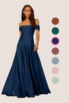 a woman in a long blue dress standing next to an assortment of color swatches