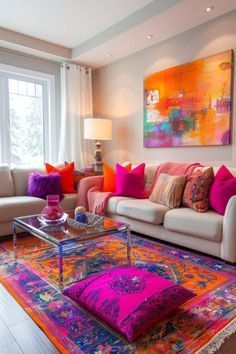 a living room filled with lots of furniture and colorful pillows on top of the couches