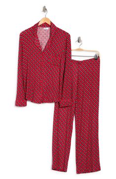 A soft jersey knit pajama set with a pretty print delivers feminine style and essential comfort. 2-piece set Shirt: 25" length (size S); Pants: 9.5" rise, 32" inseam (size S) Shirt: notch lapel, long sleeves, front button closures, chest patch pocket, allover print, contrast piping, knit construction Pants: elasticized waist, pull-on style, allover print, knit construction 95% rayon, 5% spandex Machine wash cold Imported Model’s stats for sizing: 5’11” height, 32” bust, 24” waist, 34” hips. Mode Red V-neck Loungewear Set, Fitted Sleepwear For Loungewear In Fall, Fitted Fall Sleepwear For Loungewear, Long Sleeve Printed Loungewear Sets, Printed Long Sleeve Lounging Sets, Long Sleeve Printed Lounging Sets, Long Sleeve Printed Lounge Sets, Stretch Long Sleeve Loungewear Sets, Stretch Long Sleeve Sets For Pajama Party