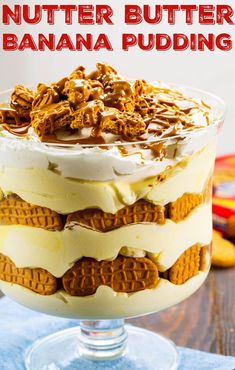 a layered dessert in a glass dish with the words nutter butter banana pudding on top