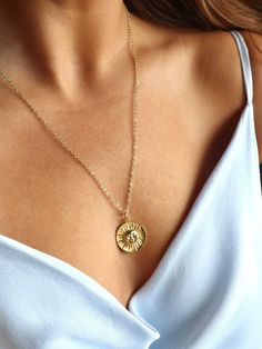 This 18kt gold-filled sun medallion pendant is sure to shine brightly on all who wear it. Featuring a beautiful sun on this coin, this necklace is the perfect everyday statement of optimism and abundance. 🌞 Gold chain length measures 20-22inches and is adjustable. Medallion Necklace Aesthetic, Yellow Gold Medallion Necklace With Sun Design, Gold Medallion Necklace With Sun Design, Sun Medallion, Gold Medallion Necklace, Etsy Promotion, Gold Medallion, Coin Pendant Necklace, Gold Sun