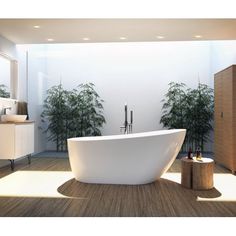 a large white bath tub sitting in the middle of a bathroom