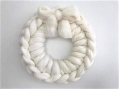 a white yarn wreath on a white background