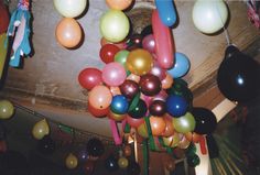 many balloons are hanging from the ceiling