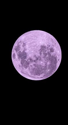 an airplane flying in the sky with a large purple moon behind it's back