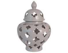 a white vase with black stars on it