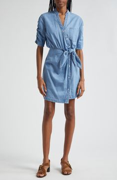 Ruched sleeves and a front tie detail put a contemporary spin on a nonstretch denim shirtdress in a mini length. 33 1/2" length Front snap closure Band collar Elbow-length sleeves Attached waist tie 100% cotton Dry clean Imported Belted Denim Dress For Summer Workwear, Fitted Cotton Shirt Dress With Tie Waist, Mini Length Shirt Dress With Tie Waist For Work, Chic Button-up Denim Dress For Work, Casual Belted Shirt Dress Mini Length, Casual Belted Mini Shirt Dress, Summer Workwear Denim Mini Dress, Summer Denim Mini Dress For Work, Denim Button-up Mini Dress For Work