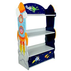 A Fantasy Fields Kids Wooden Outer Space Bookshelf with Drawer, Blue from the Outer Space collection, with rocket ships, astronauts, stars, comets and aliens illustrated on the shelving unit. Space Bookshelf, Fantasy Fields, 3 Shelf Bookcase, Playroom Storage, Space Fantasy, Wooden Bookcase, Space Room, Kids Bookcase, Bookshelves Kids