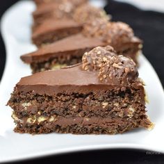 two pieces of chocolate cake on a white plate