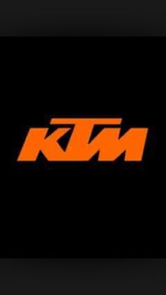 the ktm logo is shown in orange and black on a black background with white letters