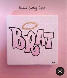 a pink and white painting with the word brata on it's back side