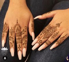 two hands with henna tattoos on them and one has a crown tattoo on it