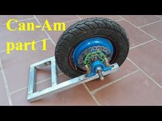 a blue wheel on top of a metal frame with the words can - am part 1