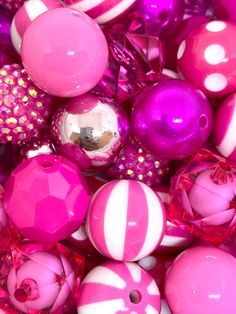 many pink and white beads are grouped together