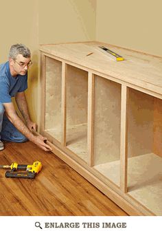 a man is working on an unfinished shelf