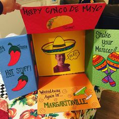 three boxes with mexican themed cards on them