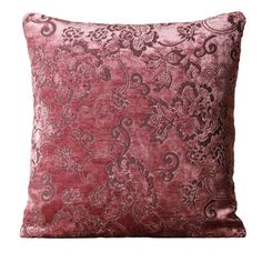 a red velvet pillow with an intricate design on the front and back, sitting on a white background