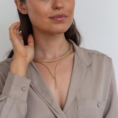 Stand out from the crowd wearing our beautiful statement necklace available in gold or silver plate. See our range of necklaces here https://www.etsy.com/uk/shop/IndisaJewellery?ref=shop_sugg_market&section_id=15529877 See our store here  https://www.etsy.com/uk/shop/IndisaJewellery Indisa jewellery will be lovingly hand wrapped and packaged within our eco-friendly signature boxes for that extra special unboxing experience. Sending a gift? Personalise your item with one of our message cards. To Elegant Gold Choker Bib Necklace, Elegant Gold Brass Drop Necklace, Gold Elegant Lariat Necklace, Elegant Gold Bib Necklace With Adjustable Chain, Minimalist Gold Drop Necklace For Party, Modern Gold Choker Necklace, Adjustable Gold Bib Choker Necklace, Elegant Gold Long Bib Necklace, Elegant Long Gold Bib Necklace