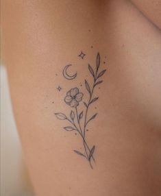 a woman's stomach with flowers and stars on it