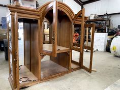 an old wooden cabinet is being worked on