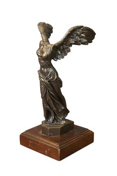 a bronze statue with an angel on it's back and wings spread out to the side