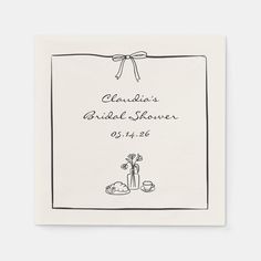 a white card with the words claudia's bridal shower on it and a potted plant