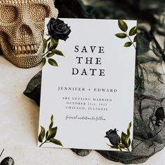 an image of save the date card with black roses on it next to a skull