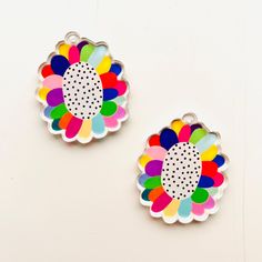 Rainbow flower statement acrylic earrings are gorgeously colourful and the perfect match to any outfit!  Made from acrylic these beautiful earrings measure 38mm. They have an original design printed in high quality inks on one side.  Making them lovely and lightweight with a delicate dangle. Hung on a stainless steel hoop they securely fasten when worn. If a different finding is preferable please just message and I can sort this.  The design has been sealed with varnish to protect it. To maintai Rainbow Flower, White Circle, Colorful Earrings, Earrings White, Rainbow Flowers, Acrylic Earrings, Beautiful Earrings