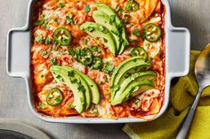 an enchilada dish with avocados and cheese