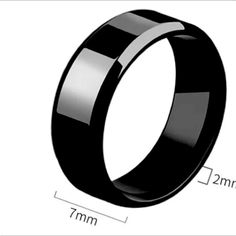 an image of a black wedding ring with measurements for the size and width on it