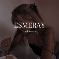 a woman sitting at a table eating food with the words esmeray above her