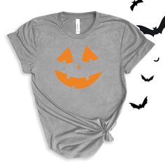 Jack O' Lantern Pumpkin Face graphic in pink or orange. Perfect for this spooky season! Wear to school dress up days, Halloween parties, or just around town for halloween spirit! For All Adult Pumpkin Face T-shirts click here to view.For Adult Sweatshirts click here to view.For Youth/Toddler T-shirts click here to view.For Youth Sweatshirts click here to view.For Baby Bodysuits click here to view. Adult Sizes S-XXL (unisex sizing)Youth Sizes S-XL (unisex Sizing)Toddler Sizes 2T, 3T, 4TBaby Bodysuit Sizes 6 Months, 12 Months, 18 Months Bella + Canvas (Adult, Youth & Toddler T-shirts)4.2 oz. Airlume combed and ring-spun cottonPre-shrunkFor a more relaxed fit, size up! Baby Bodysuit4.5 oz, 100% combed ring-spun cotton fine jerseyInnovative three-snap closure Fall Costume Party Short Sleeve T-shirt, Fall Short-sleeved T-shirt For Costume Party, Fall Short Sleeve T-shirt For Costume Party, Fall Crew Neck T-shirt For Costume Party, Fun Halloween Costume Party T-shirt, Fun Halloween T-shirt With Screen Print, Halloween Fun T-shirt With Screen Print, Fun Pre-shrunk Halloween T-shirt, Fun Halloween T-shirt Pre-shrunk