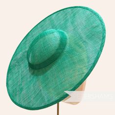 *This is not a fitted hat! You will need to sew in a headband or comb to attach it to your head* This emerald cartwheel hat base is a classic shape that has sprung into popularity in the past year. Made from 2 layers of stiffened sinamay, these cartwheels are ready to trim and are fitted with a petersham ribbon on the inside crown edge. Simply add a comb or headband to secure to the head. Hat base measures: Width: 35.5cm (14 inches) Crown Width: 13.5cm (5.3 inches) Crown Height: Approximately 3.5cm (1.7 inches) In this listing we give you the option of attaching an elastic, this is to help secure the fascinator base to your head as it is not a fitted/finished headpiece. If you would prefer to use a headband or a comb, these can be purchased separately in our shop for you to sew in. For eve Green Straw Hat With Curved Brim For Garden Party, Green Curved Brim Straw Hat For Garden Party, Green Brimmed Straw Hat For Garden Party, Adjustable Green Costume Hats With Short Brim, Green Wide Brim Straw Hat For Garden Party, Fitted Hat With Round Crown For Kentucky Derby, Green Straw Hat With Adjustable Flat Brim, Green Adjustable Straw Hat With Short Brim, Green Short Brim Straw Hat For Kentucky Derby