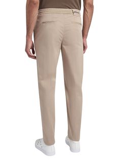 Beige cotton trousers with jogger-style waist. The Kiton trouser, an icon of casual style, is reinterpreted with a relaxed twist thanks to volumes that are roomier at the pelvis, wide on the leg and narrower at the bottom in order to offer an authentic experience of comfort. The drawstring waist with a sporty soul meets darts inspired by the world of tailoring to express the casual and elegant vocation of the garment. The opening of the leg is 18 cm on a base size of 50 (Italian). We recommend hand washing inside-out at 30 C. Dry cleanComposition: 97% Cotton, 3% Elastane, Detail, 100% Cotton Cotton Tapered Leg Chinos, Classic Cotton Chinos With Elastic Waistband, Modern Cotton Bottoms With Straight Hem, Tapered Chino Cotton Twill Pants For Spring, Classic Cotton Sweatpants With Straight Hem, Elevated Casual Tapered Leg Chinos With Elastic Waistband, Tapered Cotton Pants With Straight Hem, Spring Tapered Chino Cotton Twill Pants, Elastic Waistband Tapered Leg Chinos For Elevated Casual