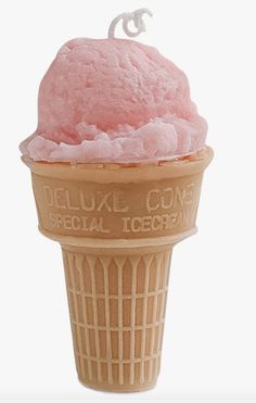 an ice cream cone with pink icing on top