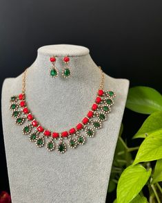 A Coral CZ necklace elegant set for your local gatherings or parties. Height of the earrings: 3.2 Cm Width of the earrings: 1.5 cm Care Instruction : Avoid Heat & Chemicals Like Perfume, Deo, Alchol, Etc. | Clean With Dry Cotton Cloth | Pack In our Anti tarnish box after use. Elegant Christmas Jewelry With Dangle Shape, Elegant Christmas Celebration Jewelry, Christmas Celebration Jewelry With Matching Earrings, Elegant Christmas Party Necklaces, Elegant Christmas Jewelry With Matching Earrings, Elegant Necklaces For Christmas Festivities, Elegant Necklaces For Christmas Festive Occasions, Elegant Christmas Necklace For Festive Occasions, Costume Jewelry Sets With Matching Earrings For Celebration