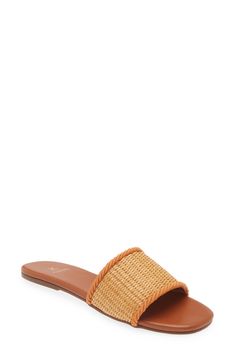 A woven raffia vamp enhances the sunny-day appeal of a minimalist slide sandal lined in soft leather and grounded by a slim rubber sole. Synthetic and textile upper/leather lining/rubber sole Imported Hispanic & Latinx Owned/Founded Spring Vacation Sandals With Woven Leather, Spring Natural Woven Leather Sandals, Natural Sandals With Textured Straw Sole, Straw Open Toe Slides With Textured Footbed, Straw Slides With Textured Footbed And Open Toe, Summer Sandals With Woven Straw Sole, Flat Woven Leather Sandals For Beach, Summer Sandals With Textured Sole And Straw Material, Woven Summer Slides For Beach