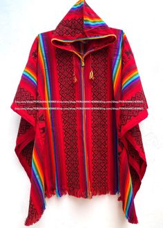 "Our traditional poncho has been made with the quality and rustic appereance of the natural Alpaca and designed in a very particular and nice style. Its an original versatile garment from the andes of Peru! MATERIAL: Alpaca Wool. Alpaca Wool is hypoallergenic, light and warm. Its fibers contain microscopic air bags that make the garments light and delicate while acting as excellent insulators. WARM & SOFT: It will surely keep you warm on cold winter days. You will find that the materials really Traditional Red Poncho For Fall, Traditional Red Fall Poncho, Red Bohemian Poncho For Festival, Folk Style Red Poncho For Winter, Red Folk Style Poncho For Fall, Red Bohemian Poncho For Winter, Traditional Red One-size Poncho, Red Bohemian Shawl Poncho, Bohemian Red Shawl Cape