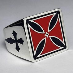 A Sterling silver ring. 💍 Amazing red Templar cross ring.  📜 Big square silver ring with a red templar cross on top and black     sword crosses on the sides. An amazing Crusaders ring!       Hi-quality craftwork with special engraving in and out all        ring surfaces,        remarkable enamel handmade oven works all over the        ring, black oxidized work inside, and a very strong hand        polishing make this ring unbeatable for        He who wears it!  ✍ Designed and created by Babuco Jewellery Athens. 🛠 All silver rings are stamped 925 & BJA!  ♻ Recycled piece.  ⚖ Weight 17gr.  📐 18mm 🔳 square   🎁 Gift box included.  😊 Thank you for stopping by.  ✈ Do You need faster shipping? Purchase EXPRESS SHIPPING also from my listings! 🛠   Free services to renew your beloved jewels Red Symbolic Sterling Silver Ring, Templar Cross, Classic Silver Cross Rings, Malta Cross, Classic Silver Cross-shaped Rings, Silver Cross Ring With Polished Finish, Iron Cross Ring, Silver Jewelry Cleaner, Strong Hand