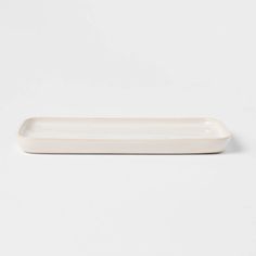 a white rectangular dish on a white background