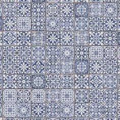 a blue and white tile wall with many different designs