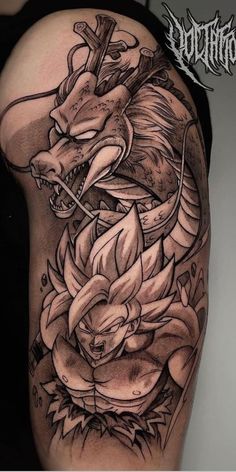 a black and white photo of a dragon tattoo