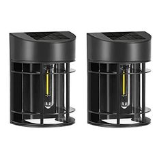 two black lamps with yellow lights on them