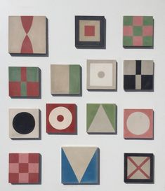 nine different shapes and sizes of tiles on a white surface