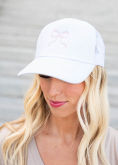 White embroidered bow hat with pink bow White Trucker Hat With Embroidered Logo For Spring, White Embroidered Hat With Curved Bill, Spring Hats With Curved Visor, White Embroidered Hat One Size, Cute White Snapback Hat With Curved Brim, Trendy White Embroidered Hat, Cute White Baseball Cap, Embroidered Bow, Plus Jumpsuit