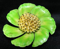 "C1960's Original by Roberts Green Enameled Flower with Yellow Center A beautiful addition to the spring collection. The pin is in very good condition and measures 2-1/8\" across. The leaves are lime green over the yellow background. Roberts cartouche on back. The blossom center are spikes of yellow with tiny black tips." Green Flower-shaped Enamel Brooch Pin, Green Flower Shaped Enamel Pin Brooch, Green Flower Enamel Pin Brooch, Vintage Green Flower Brooches, Vintage Yellow Flower Brooch, Black Tips, Green Enamel, Yellow Background, Flower Brooch